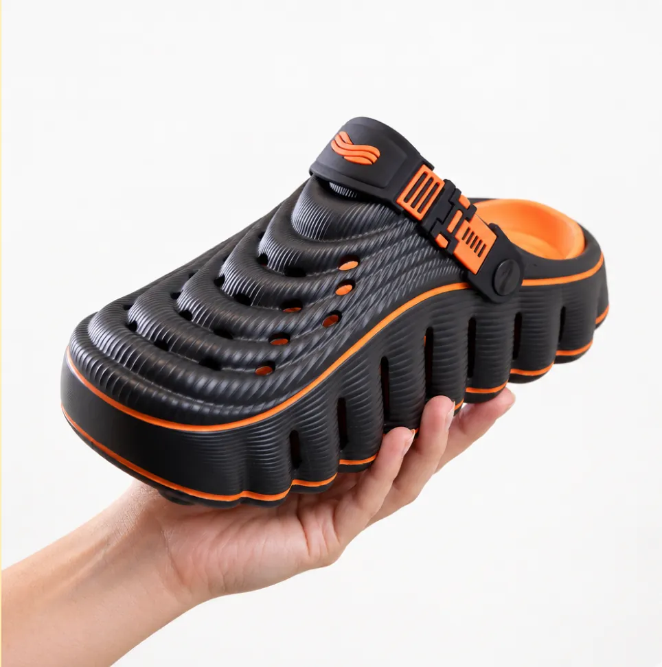 RESTORE clog held in hand showing the thick EVA sole